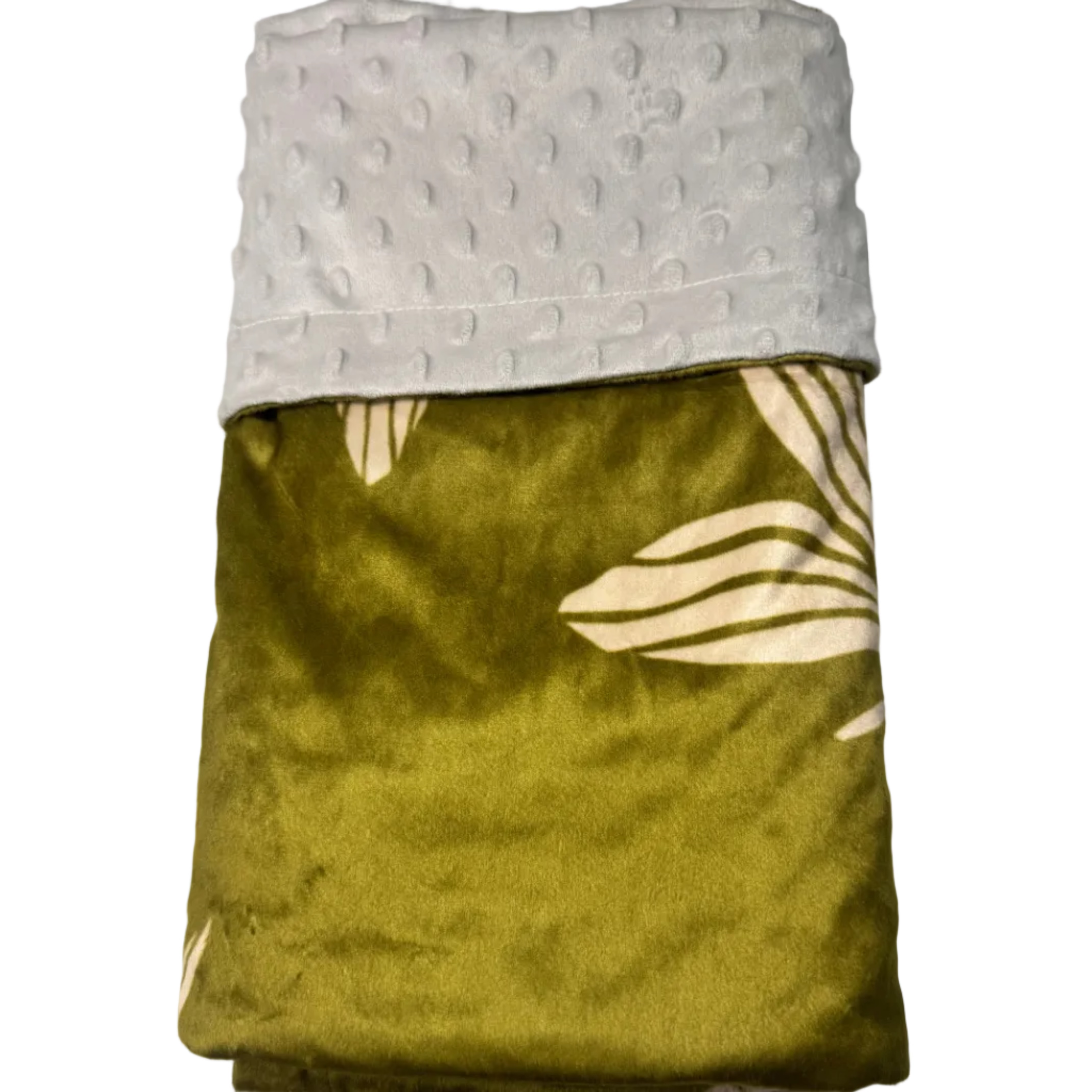 A folded throw blanket with a textured light gray minky fabric on one side and an olive green velvet side with a cream plumeria pattern, displayed on a white marble surface.