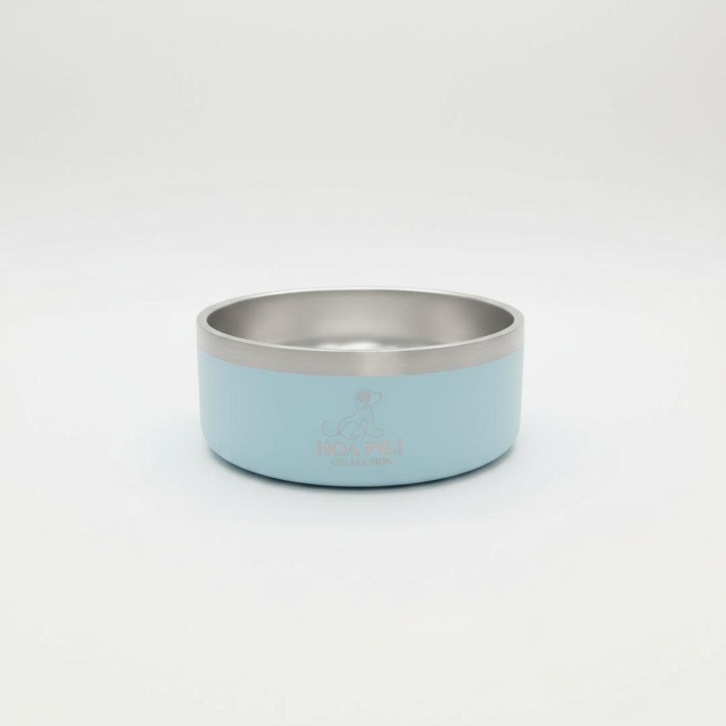 Light blue and silver dog bowl with 'hoa pili' branding on a white background