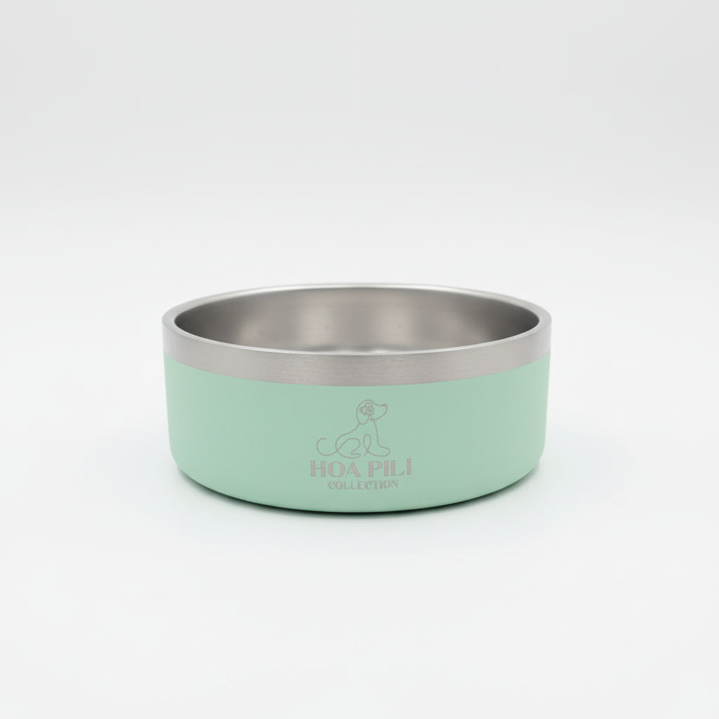 Green and silver dog bowl with 'HOA PILI' branding on a white background