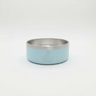 Light blue and silver dog bowl with 'hoa pili' branding on a white background